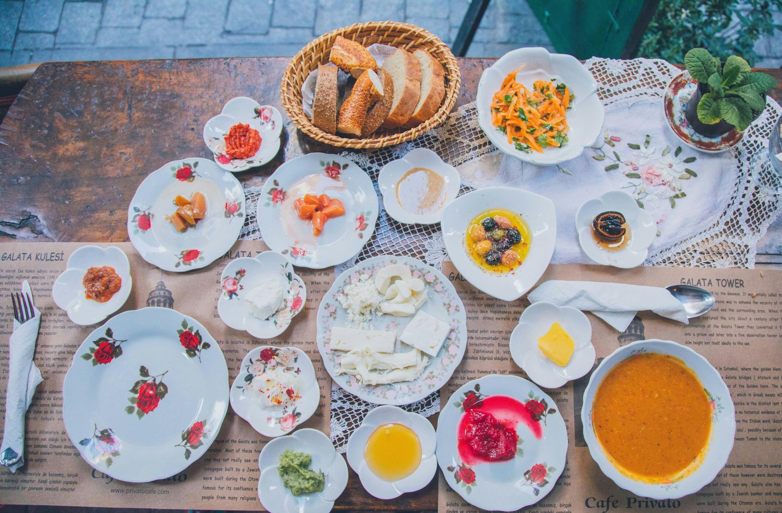 Colorful spread of fresh fruits, vegetables, herbs, spices, and grains on a wooden table