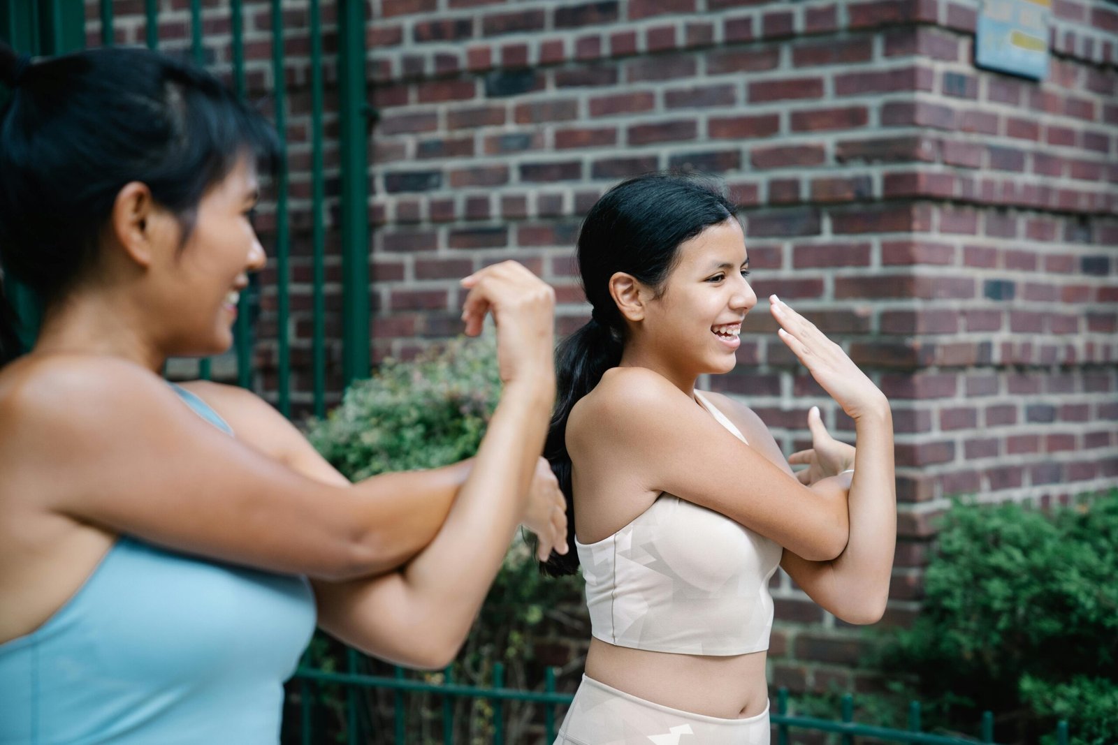 Photo of Jessica smiling outdoors wearing activewear after adopting her pitta-balancing routine