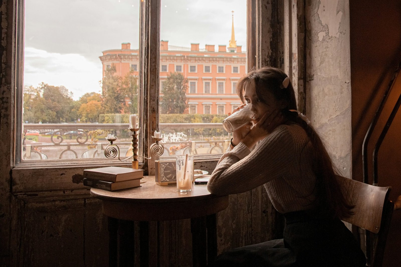 A woman enjoying a meal peacefully at her dining table