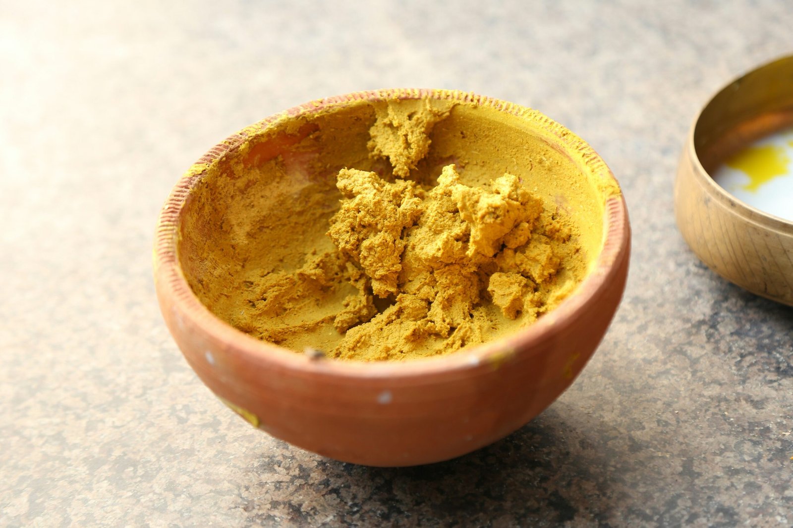 Before and after photo of someone using Triphala powder as part of their Ayurvedic regimen.
