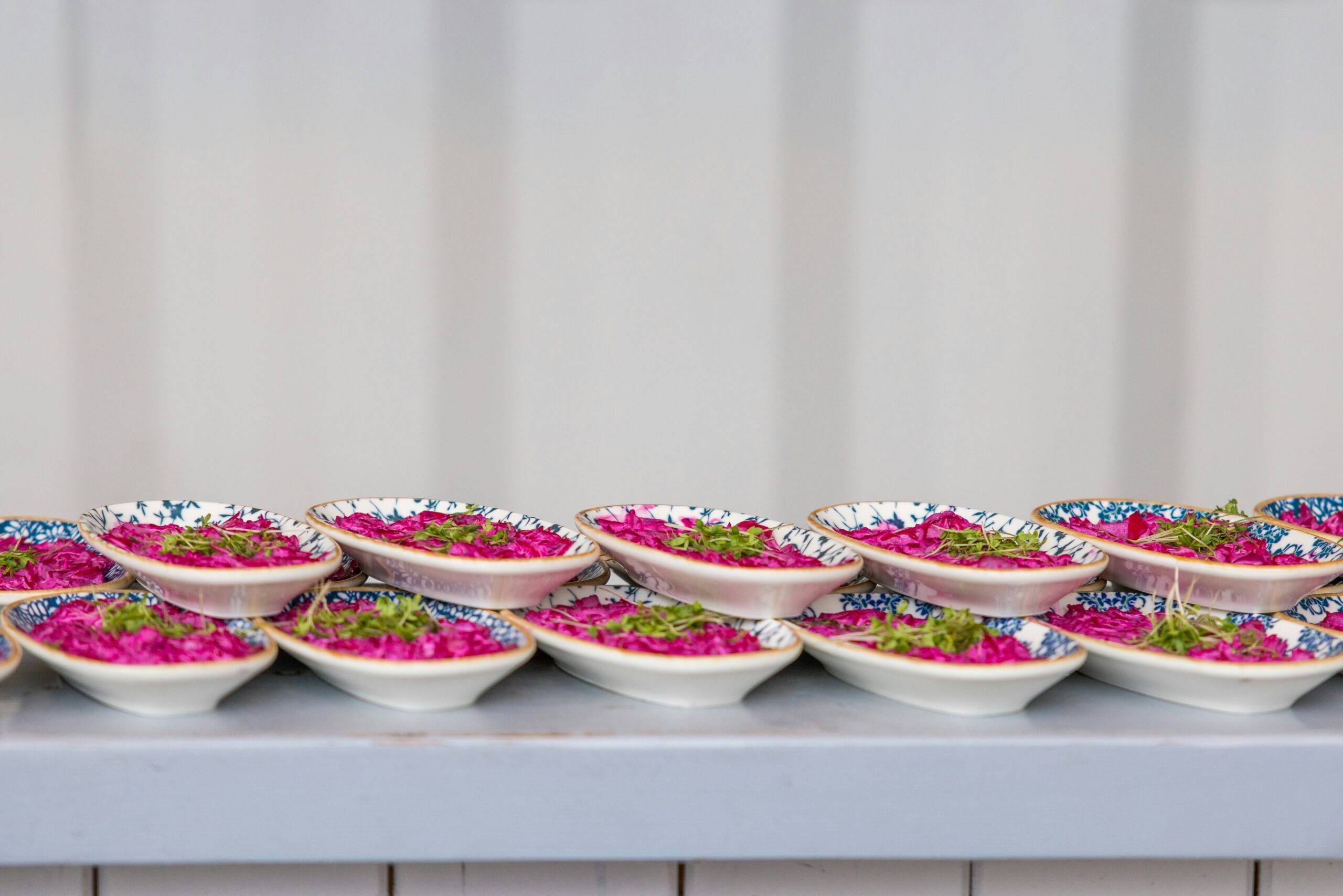 Colorful bowls filled with Ayurvedic meals such as dal, quinoa, and steamed vegetables.