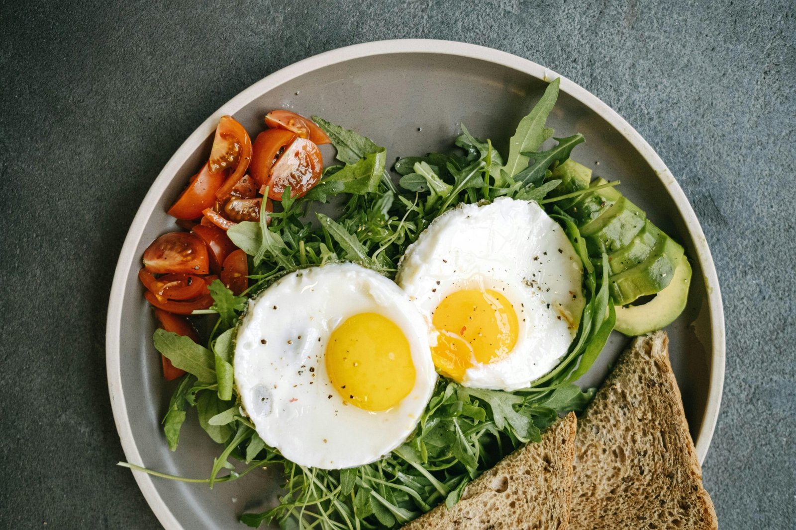 Colorful plate of fresh vegetables and grains representing Ayurvedic diet