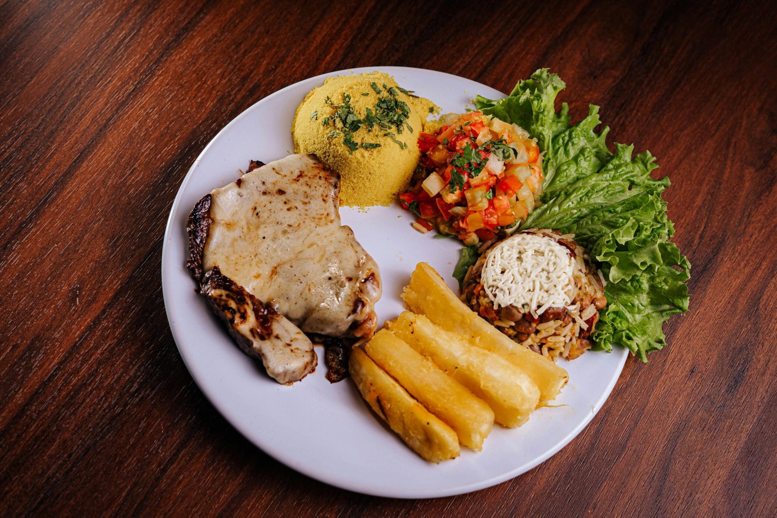 Plate featuring balanced portions of grains, vegetables, and spices