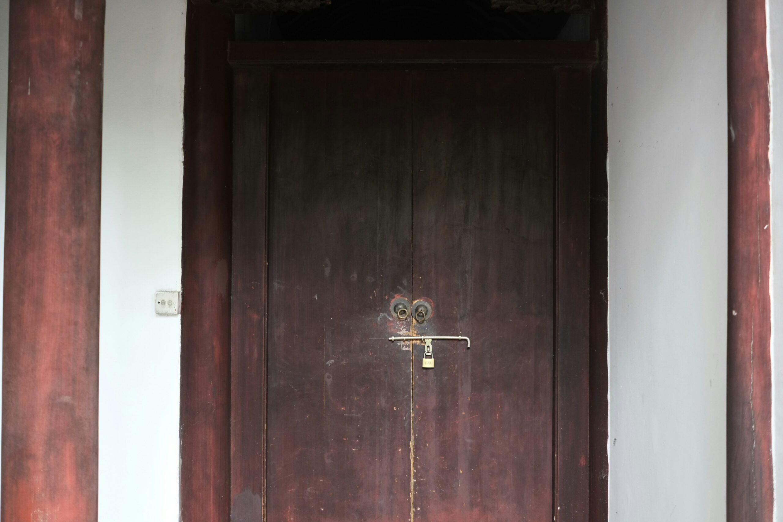 a wooden door with a metal handle on it